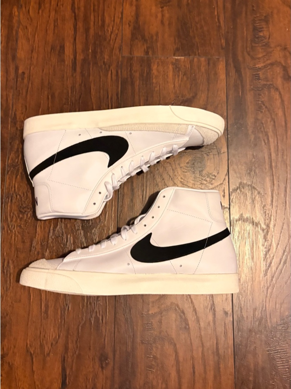 Nike White High-Top Sneakers with Black Swoosh